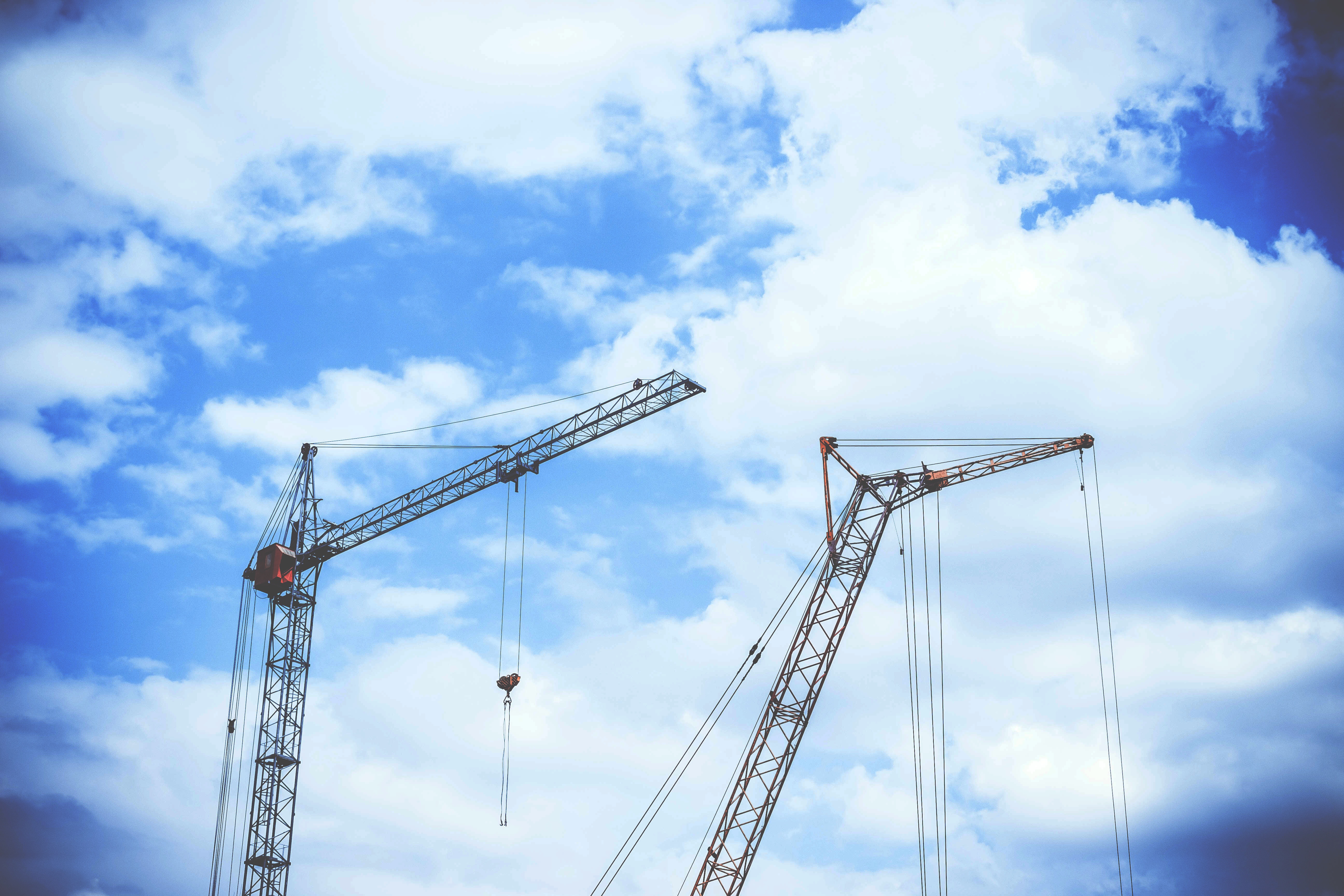 Crane On The Construction Site, At Beautiful Blue Sky With White Clouds ...