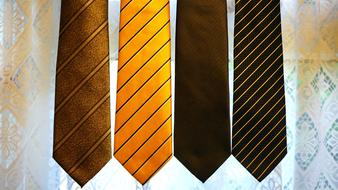 brown and yellow striped ties