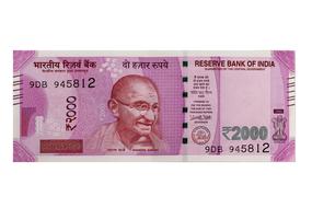 Colorful "2000" rupee banknote with the portrait of Gandhi in India, at white background