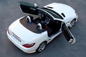White Mercedes car with open doors