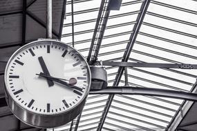 Black and white photo with the clock on the station