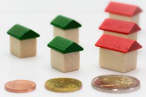 Money Euro Coin and wood home