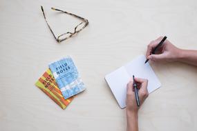 pens and paper on the table