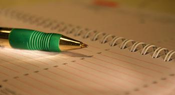 pen on appointment calendar close up