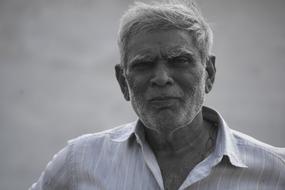 black and white photo of an elderly farmer