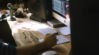 Apple PC on the wooden desk