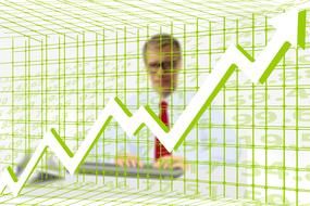 businessman behind green grid and arrow up, success