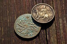 two antique indian coins