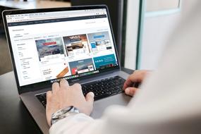 a man sitting at a laptop