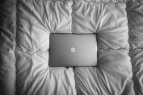 Macbook Laptop on pillow