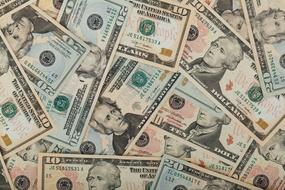 a lot of dollar banknotes cash