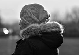 black and white picture of a man in knit hat