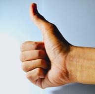 thumb of male hand as a gesture