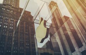 Apple Company logo on glass facade of Building
