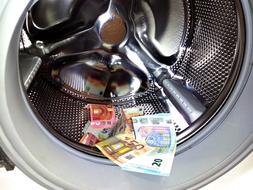 euro banknotes in the washing machine