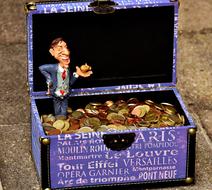 Businessman chest of coins