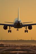 rear view airplane taking off