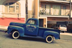 crown customs vintage blue Truck parked on roadside