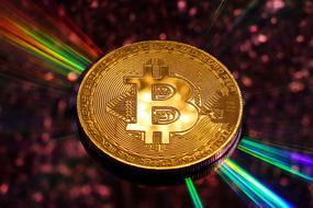 bitcoin in the rays as a background