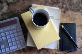 Coffee Mug and Pen and book