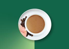 coffee cup on saucer with print at green background