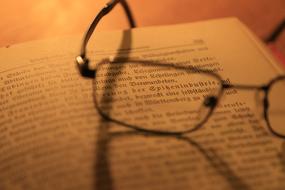 Glasses on open book, detail