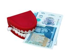 five pounds bills in artificial teeth