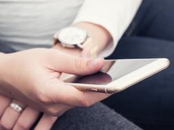 white Iphone in female hands