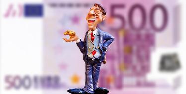 figurine of a successful businessman on the background of the euro