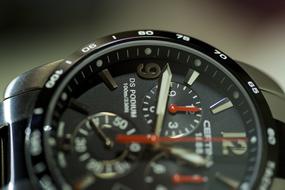 wristwatch dial close-up on blurred background