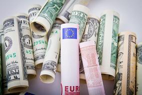 bundles of euro and dollar banknotes