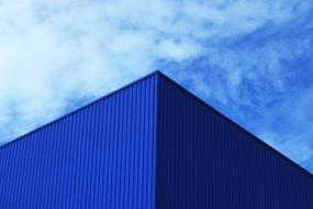 corner of blue industrial building