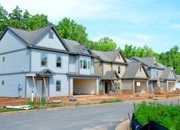 New suburban houses in row on roadside