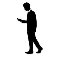 man in suit walking with mobile phone, silhouette