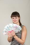 happy girl with a fan of money
