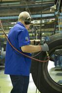 mechanic works on an industrial plant