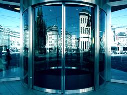 round glass Entrance Door of building in city