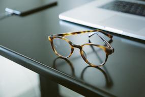 tiger glasses lie on a black table