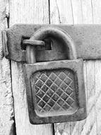 monochrome photo of lock on door