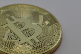 Close-up of the beautiful, gold coin with Bitcoin sign and ornament