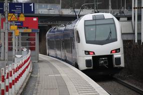 white city train at the platform