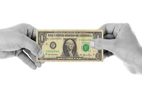 Colorful, one dollar banknote in the hands, in black and white color