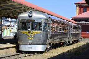 the steam locomotive stands on the railway