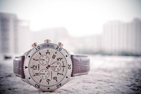 photo of men's watch with a leather strap