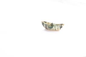 dollar banknote as paper boat