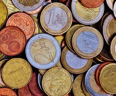 Pile of the colorful, shiny Euro coins with the patterns