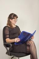 girl with blue folder in the office