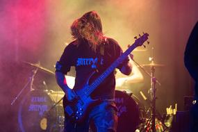 musician with an electric guitar at a concert