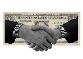 handshake on the background of the dollar