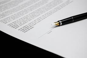 pen on Agreement Documents